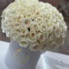 Bring beauty to the table with elegant arrangement, presented in a hat