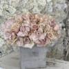 Bring beauty to the table with elegant arrangement, presented in a ceramic