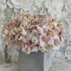 Bring beauty to the table with elegant arrangement, presented in a ceramic