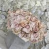 Bring beauty to the table with elegant arrangement, presented in a ceramic