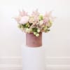 Bring beauty to the table with elegant arrangement, presented in a hat
