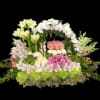 Nice and beautiful low centerpiece with a mix of white amaryllis lillies