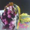 The &quot;Regal Elegance&quot; wrap bouquet is a stunning composition that celebrates the