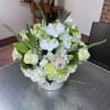 &quot;Ballet of White Petals&quot; is a stunning floral arrangement that showcases the