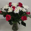 red roses white daisies with greenery 
