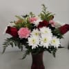 pink carnations , red roses , greenery ,white daisies 