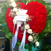 Honor a loved one with this standing heart-shaped arrangement that celebrates someone