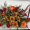 red roses,orange roses,yellow`brown margaritas ,red carnations, greenery,filling , super cute cornucopia basket