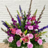 Purples &amp; Pinks in this one sided funeral arrangement.