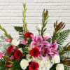 A beautiful mix of roses, lilies, and glads in white, reds, &amp;