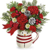Red and green flowers with assorted evergreens in an adorable snowman container