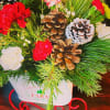 All aboard for Christmas fun! This sweet metal sled joyfully delivers a