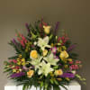 White Lilies, Pink Snapdragons, Purple Orchids, Purple Liatris, Yellow Roses, and Yellow