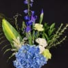 Simple and stately in Blue. Iris and delphinium with blue hydrangea in