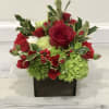 Christmas box arrangement containing single stem roses, spray roses, carnations, hydrangeas, dianthus