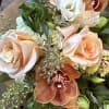 Indulge in the warm embrace of autumn with our exquisite floral arrangement