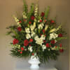 Red Roses, Red Carnations, White Lilies, White Delphinium, White Stock, with a