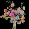Hot pink spring bouquet that includes ranunculus, garden roses, tulips, peonies, and