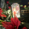 Lightup Santa train candle in classic poinsettia piece