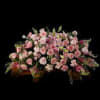 Roses, lilies, and more come together for a blushing pink half casket