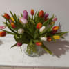 Premium assorted tulips in a  vase with confetti ribbon 
