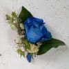 Amazing navy blue rose boutonniere with the touch o light blue delphinium