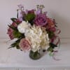 Light purple tone roses bland in with white and cream flowers