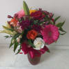 Beautiful fresh deep bright burgundy daisies, various roses and sparkly pink and