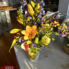 Exclusive Italian hand painted pitcher arranged with exotic tropical orchids, proteas, anturiums