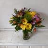 Beautiful blush mix of orange roses, alstroemeria, yellow cushion pompons, purple stuck