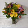 Beautiful blush mix of orange roses, alstroemeria, yellow cushion pompons, purple stuck