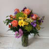 Beautiful blush mix of orange roses, alstroemeria, yellow cushion pompons, purple stuck