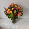 Beautiful blush mix of orange roses, alstroemeria, yellow cushion pompons, purple stuck