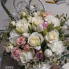 Beautiful white standard roses, pink spray roses, white tulips and white wax