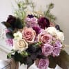 Sophisticated and classy purples in vintage handtied round bridal bouquet