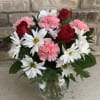 This simply beautiful mix features white daisies adorned by roses and blushed