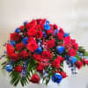 Made in blue and red roses and mixed flowers in blue and