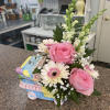 Gift new parents with a sweet floral arrangement designed in a keepsake