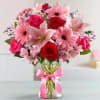 Fresh-picked pink &amp; red blooms are on display inside a glass vase