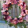 A beautiful mix of pink lilies, purple Carnations, lavender Mums to celebrate