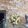 A stylish pop of winter style, this snow-white bouquet in a silver