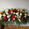 Beautiful white calla lilies, white, pink and red roses, carnations, daisies and