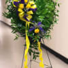 The Heart of Gold standing spray by Twin Towers Florist

A foliage-covered heart