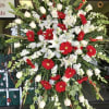 Standing tall on an easel, this standing spray is full of Roses