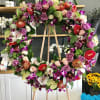 A colorful abundance of tropical florals stand tall as a wreath made