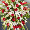 Standing tall on an easel, this standing spray is full of Roses