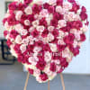 This full and absolutely gorgeous heart-shaped standing spray arrangement made of an