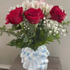 Beautiful bouquet of twelve long stem red roses, white alstroemeria flowers, baby&rsquo;s