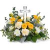 Encircling a beautiful crystal cross keepsake, this sunny bouquet of roses and