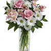 Soft and delicate, this pale pink and white bouquet speaks to the